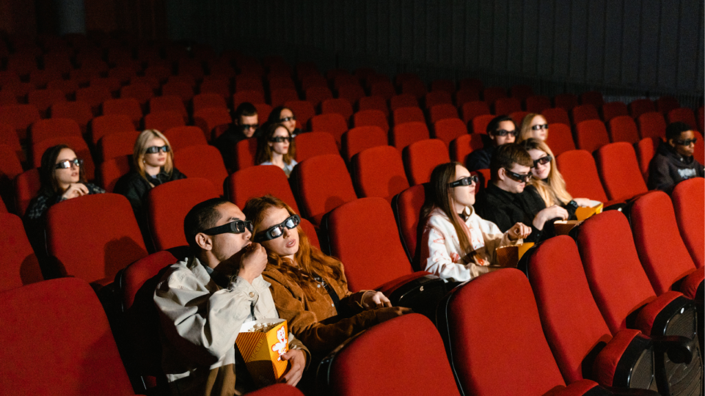 People watching movie in a theater People watching movie in a theater to learn English.