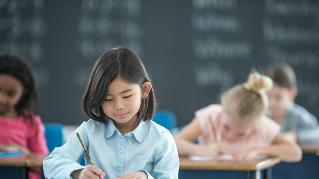 A girl storywriting in the class.